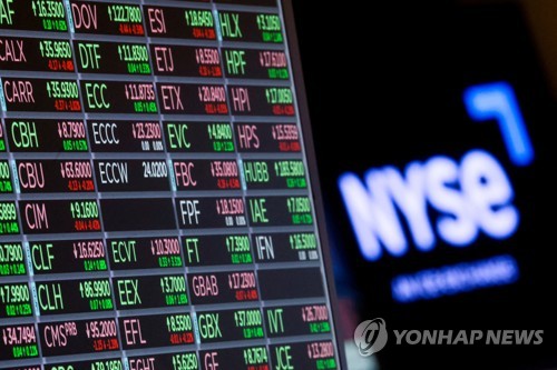 A screen displays trading informations for stocks on the floor of the New York Stock Exchange (NYSE) in New York City, U.S., June 27, 2022.  REUTERS/Brendan McDermid