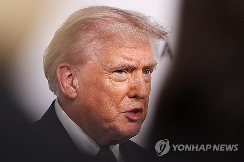 U.S. President Donald Trump arrives for the premiere of the documentary film 